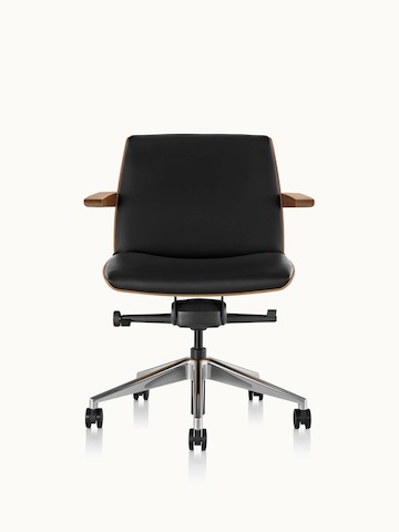 Front view of a low-back Clamshell office chair with black leather upholstery, a walnut shell, with arms.
