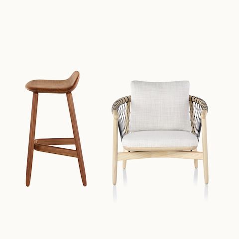 Side view of a wood Crosshatch Stool with a medium finish next to a front view of a Crosshatch lounge chair with off-white fabric.