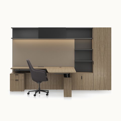 A Geiger One Private Office in Natural Flat Cut Walnut with a Saiba Office Chair viewed from the front.