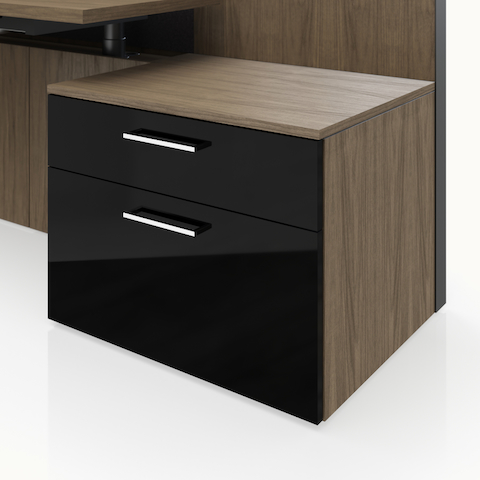 Detail shot of the Geiger One Casegoods storage with a Natural Flat Cut Walnut case and black high gloss acrylic fronts.