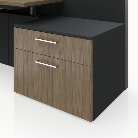 Detail shot of the Geiger One Casegoods storage with a Charcoal TFL case and Natural Flat Cut Walnut fronts.