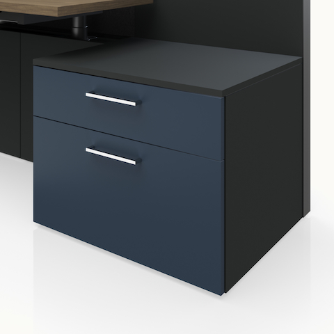 Detail shot of the Geiger One Casegoods storage with a Charcoal TFL case and naval blue painted fronts.