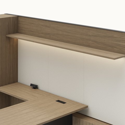 Detail shot of the Geiger One Casegoods wood shelf overhead option in a Natural Flat Cut Walnut private office viewed from an angle.