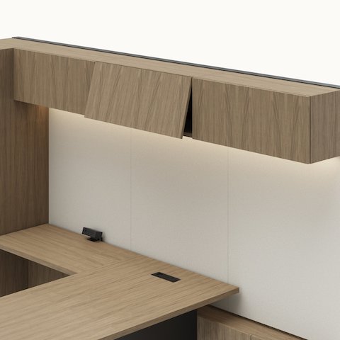 Detail shot of the Geiger One Casegoods overhead with flip up doors option in a Natural Flat Cut Walnut private office viewed from an angle.