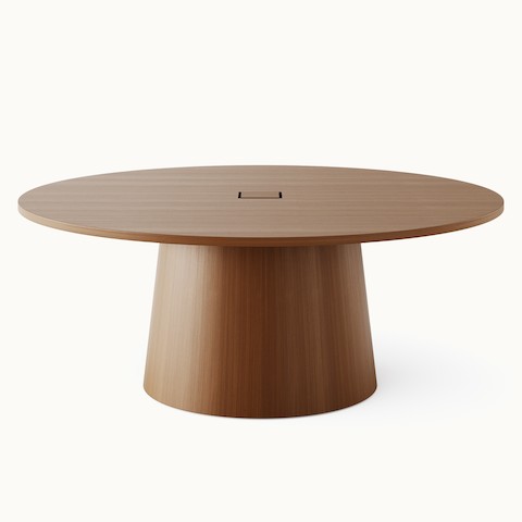 JD Meeting Table by DatesWeiser with round top and round tapered base in natural quarter cut walnut shown front-facing on a white sweep. JD Meeting Table by DatesWeiser with round top and round tapered base in natural quarter cut walnut shown front-facing on a white sweep.