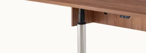 Close-up of the underside of an MP Height-Adjustable Table, showing the height-adjustment button.