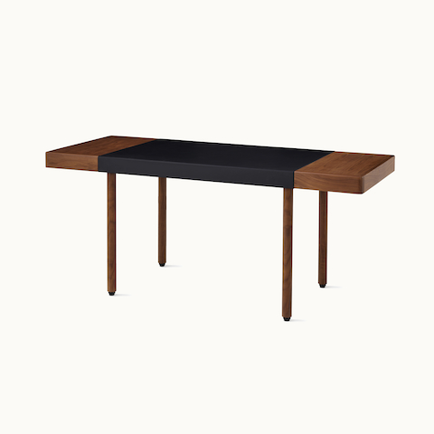 New Canaan Leatherwrap Sit-to-Stand Desk in walnut and black leather, two drawers, angled view. Select to go to the Leatherwrap Sit-to-Stand Desk product page. New Canaan Leatherwrap Sit-to-Stand Desk in walnut and black leather, two drawers, angled view. Select to go to the Leatherwrap Sit-to-Stand Desk product page.