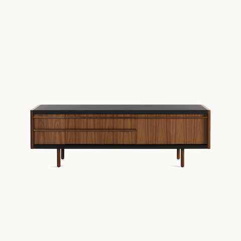 New Canaan Media Unit designed by BassamFellows for Geiger in Walnut with Black Leather shown in front view on a white sweep. New Canaan Media Unit designed by BassamFellows for Geiger in Walnut with Black Leather shown in front view on a white sweep.